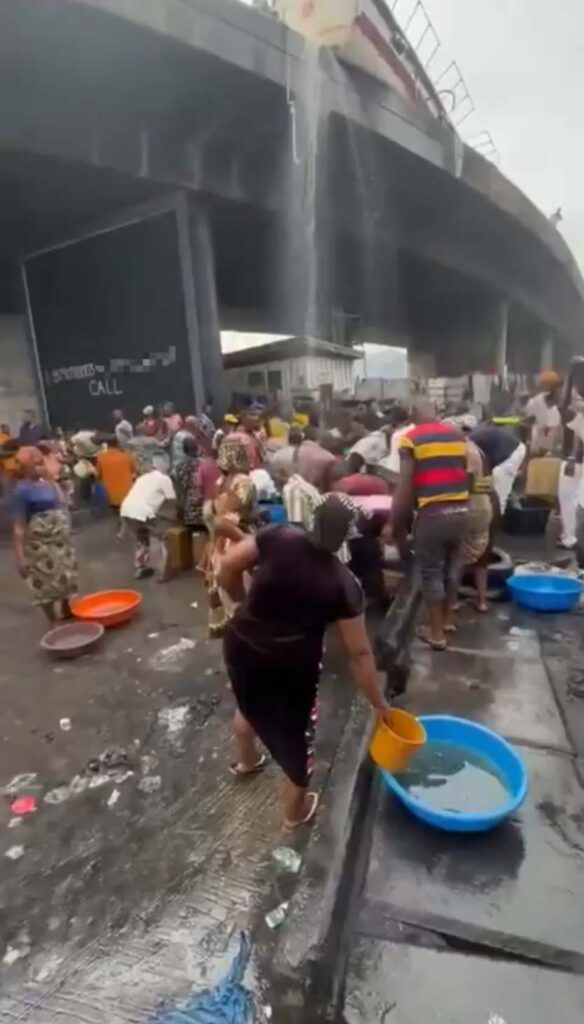 Shocking Moment as People Rush to Scoop Fuel from Overturned Tanker